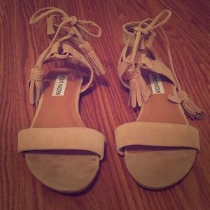 Nude suede sandals with tie tassels